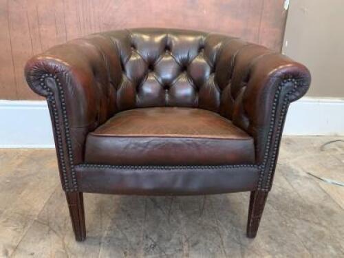 Brown Leather Button Back Arm Chair with Stud Detail on Wooden Feet. Size H70cm x W77cm x D70cm.