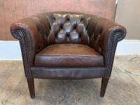 Brown Leather Button Back Arm Chair with Stud Detail on Wooden Feet. Size H70cm x W77cm x D70cm.