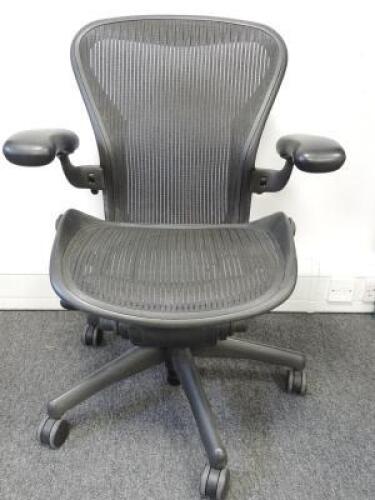 Herman Miller Aeron Ergonomic Adjustable Mesh Office Chair in Graphite Grey with Adjustable Arm Rests & Leather Padded Arm Caps, Size B.