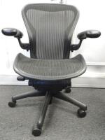 Herman Miller Aeron Ergonomic Adjustable Mesh Office Chair in Graphite Grey with Adjustable Arm Rests & Leather Padded Arm Caps, Size B.