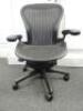 Herman Miller Aeron Ergonomic Adjustable Mesh Office Chair in Graphite Grey with Adjustable Arm Rests & Leather Padded Arm Caps, Size B.