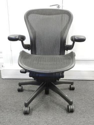 Herman Miller Aeron Ergonomic Adjustable Mesh Office Chair in Graphite Grey with Adjustable Arm Rests & Leather Padded Arm Caps, Size B.
