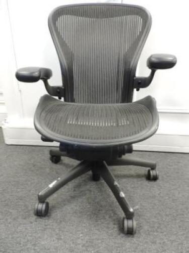 Herman Miller Aeron Ergonomic Adjustable Mesh Office Chair in Graphite Grey with Adjustable Arm Rests & Leather Padded Arm Caps, Size B.