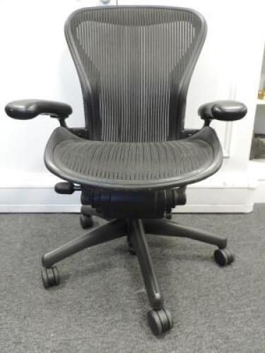 Herman Miller Aeron Ergonomic Adjustable Mesh Office Chair in Graphite Grey with Adjustable Arm Rests & Leather Padded Arm Caps, Size B.