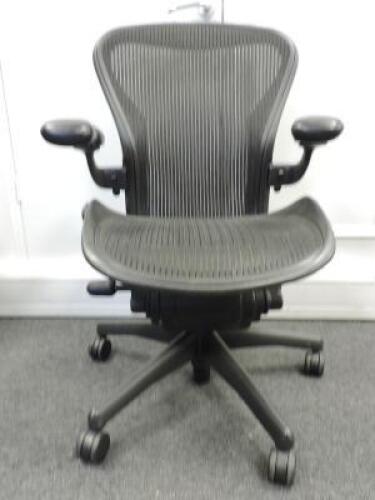 Herman Miller Aeron Ergonomic Adjustable Mesh Office Chair in Graphite Grey with Adjustable Arm Rests & Leather Padded Arm Caps, Size B.