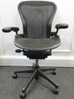 Herman Miller Aeron Ergonomic Adjustable Mesh Office Chair in Graphite Grey with Adjustable Arm Rests & Leather Padded Arm Caps, Size B.