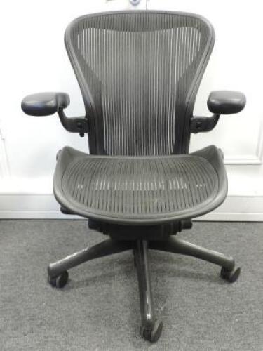 Herman Miller Aeron Ergonomic Adjustable Mesh Office Chair in Graphite Grey with Adjustable Arm Rests & Leather Padded Arm Caps, Size B.