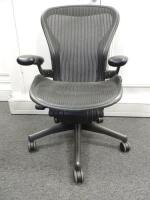 Herman Miller Aeron Ergonomic Adjustable Mesh Office Chair in Graphite Grey with Adjustable Arm Rests & Leather Padded Arm Caps, Size B.