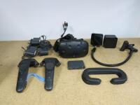 HTC Vive Virtual Reality System to Include: 1 x Headset, 2 x Controllers Model 2PR7100 2 x Base Stations, 1 x Link Box Model 2PU6100, 3 x Power Supplies & Assorted Cables.