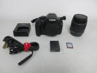 Canon EOS 11OOD Digital SLR Camera Body, Model DS126291, S/N 123062174069. Comes with Canon Ef-S 18-55mm Zoom Lens, S/N 8306127485, Canon Battery Pack LP-E10, Canon Battery Charger, Model LC-E10E, 2 Lens Caps, Shoulder Strap, Basic Instruction Manual, 2 x