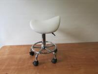 Height Adjustable Padded Saddle Stool On Chrome Frame & Upholstered in White Faux Leather.