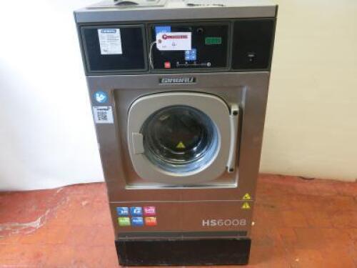 Girbau Commercial High Spin Speed Washing Machine,Capacity 9kg, Spin Speed 1000rpm, Model HS-6008-LC-E, S/N 2099426.Size H108cm x W69cm x D68cm.Washing Machine mounted on Metal Stand, Total Height 128cm.NOTE:plug required 