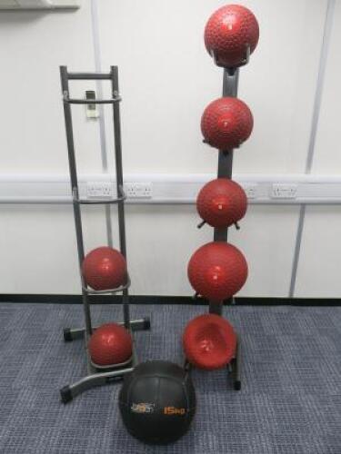 Lot of 8 Jordan Medicine Balls with 2 Free Standing Metal Racks to Include: 2 x 15kg, 1 x 12kg, 1 x 9kg 3x 7kg & 1 x 5kg.