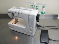 Janome Cover Pro 1000CPX Sewing Machine, S/N 796210914. Comes with Foot Pedal & Cover.