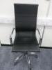 High Back Office Swivel Chair Upholstered in Black Faux Leather on Chrome Base.