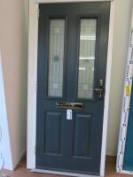 Ex Display UVPC Double Glazed 2 Panel Front Door With Frame. Blue Exterior with White Frame & Green Interior. Size H205cm x W90cm. NOTE: door is locked missing key.