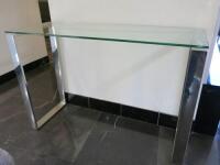 Glass Top Console Table on Polished Steel Legs. Size H75 x W110 x D40cm.