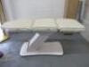 REM Excel Electric 3 Motor Beauticians Adjustable Treatment Chair/Couch Upholstered in White Vinyl and Comes with Controller, S/N 000183. NOTE: condition as viewed/pictured.