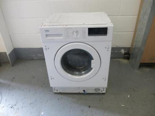 Beko Integrated Washing Machine, Model WIR725451, Capacity 7kg, 1200RPM, A+++. Size H81cm x W60cm x D52cm.