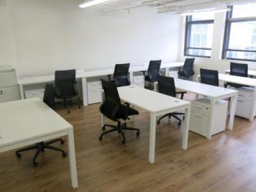 Office Suite to Include: 12 x White Melamine Desks with Power Units, 12 x Black Ergo Swivel Office Chairs, 10 x 2 Draw Pedestals & 3 Draw Triumph Filing Cabinet. Desk Size W140 x D70cm, Ped Size H55 x W40 x D52cm, Filing Cabinet Size H103 x W47 x D63m.