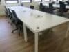 7 x White Melamine Desks with Power Units . Desk Size W140 x D70cm.