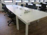 7 x White Melamine Desks with Power Units . Desk Size W140 x D70cm.