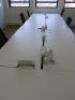 7 x White Melamine Desks with Power Units . Desk Size W140 x D70cm. - 2